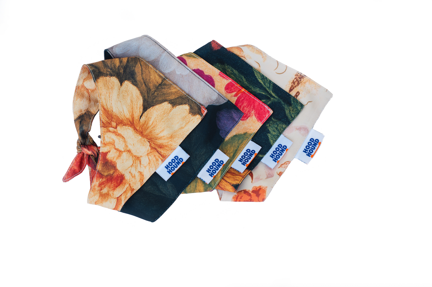 Set of floral-patterned pouches with visible brand labels on a white background
